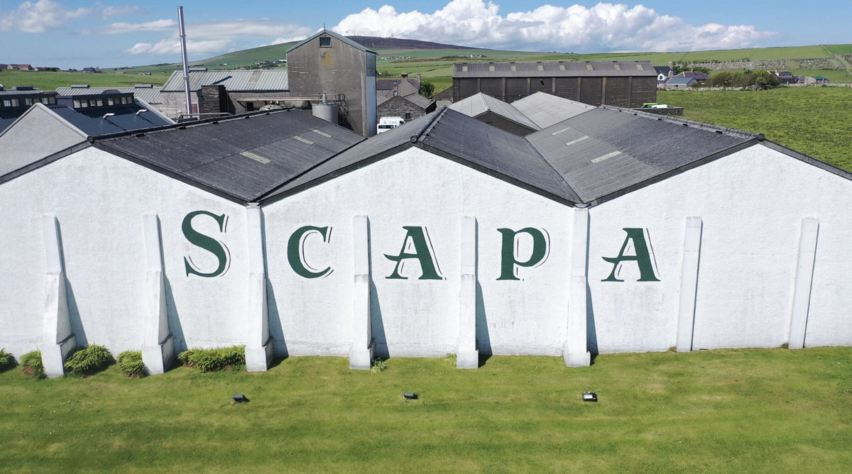 The Scapa name across the white distillery buildings on Orkney