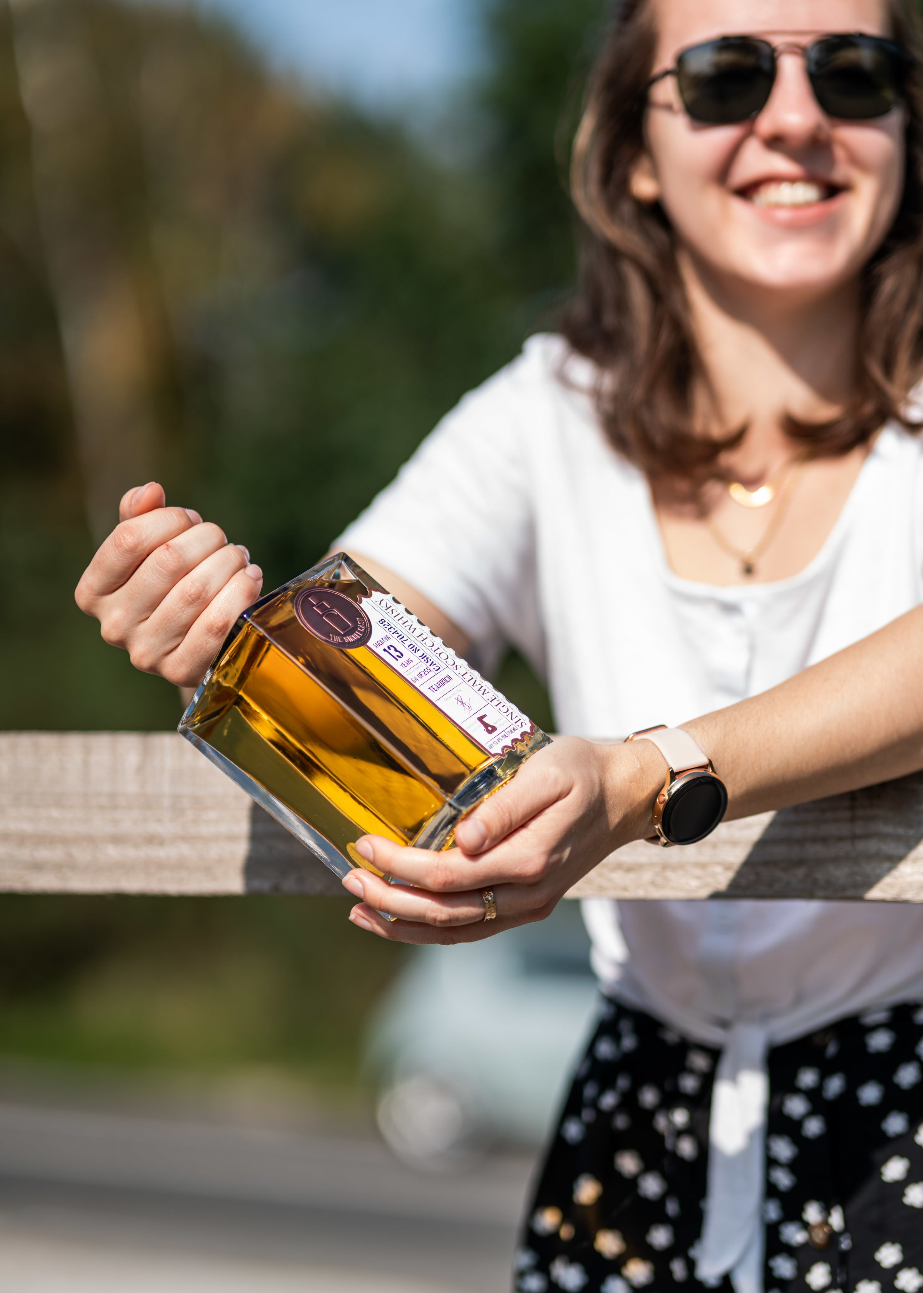 Single cask whisky bottle being held